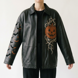 Women's Black Genuine Leather Hats – Front Zipper, Burnt-orange jack-o’-lantern artwork with ivory thorn-vine