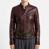 Women's Dark Burgundy Genuine Leather Jackets – Front Zipper, Antique-gold haunted-castle silhouette across the lower