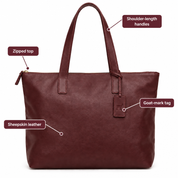 Burgundy sheepskin leather tote with labels for shoulder handles, zipped top and goat-mark tag
